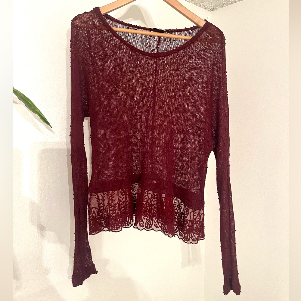 American Eagle long-sleeved, semi-sheer top with lace detailing at the hem
